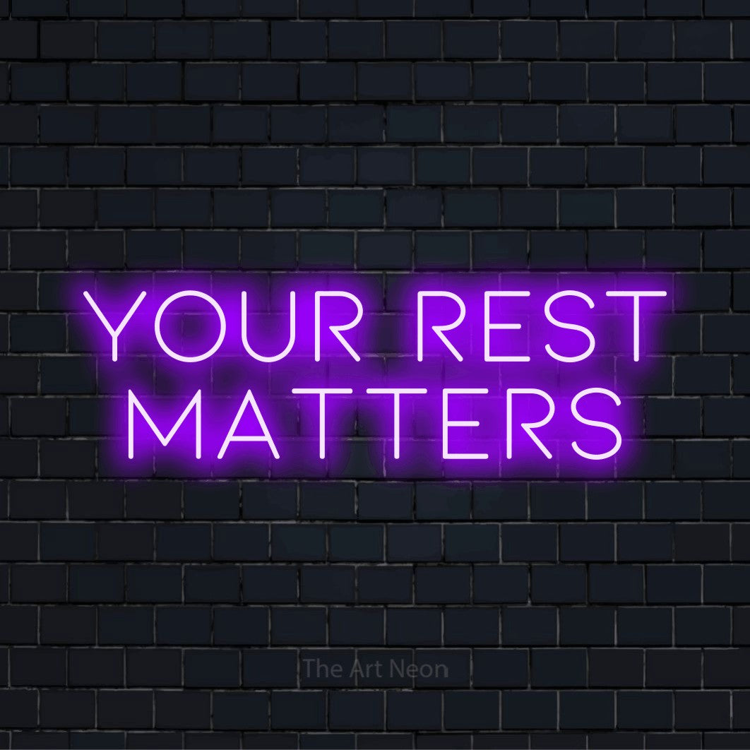 "Your Rest Matters" glowing LED neon sign on a black brick wall